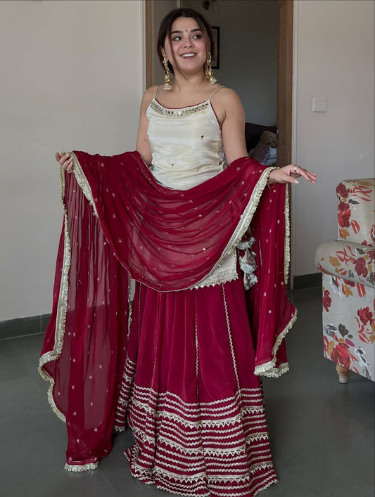 Ivory Peplum Choli with Wine Flared Lehenga- Festive & Wedding Wear