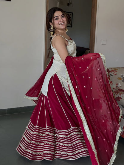 Ivory Peplum Choli with Wine Flared Lehenga- Festive & Wedding  Wear