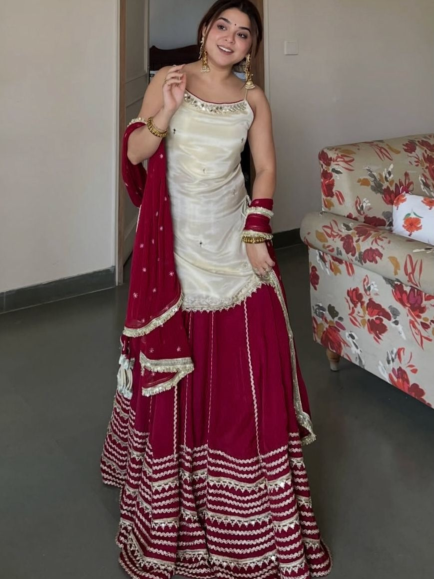 Ivory Peplum Choli with Wine Flared Lehenga- Festive & Wedding  Wear
