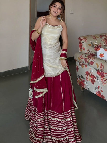 Ivory Peplum Choli with Wine Flared Lehenga- Festive & Wedding  Wear