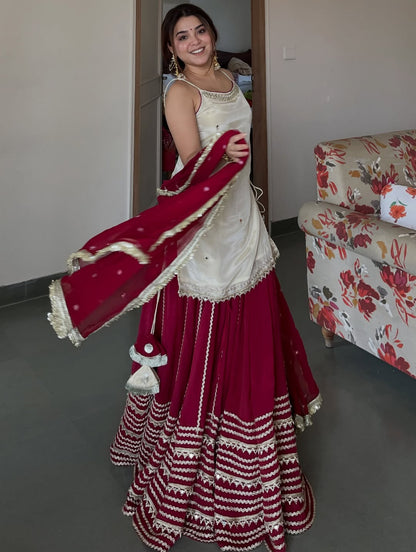 Ivory Peplum Choli with Wine Flared Lehenga- Festive & Wedding  Wear