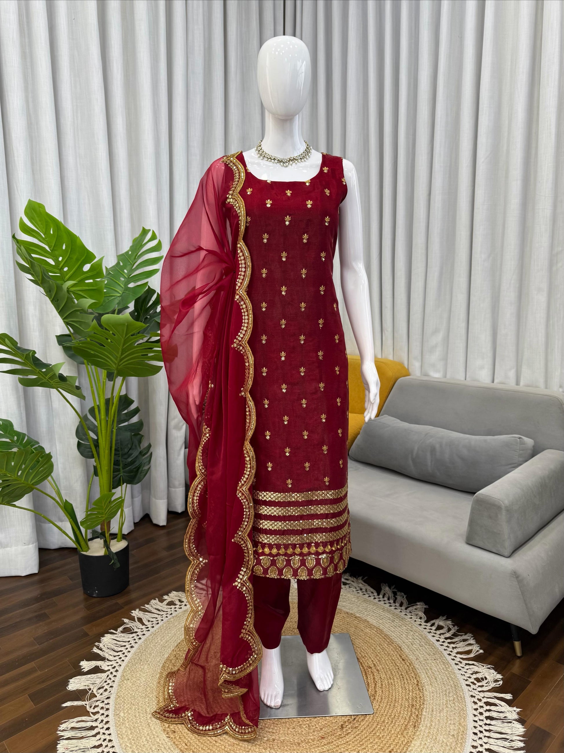 Maroon ethnic suit with gold embroidery and sheer dupatta, perfect for festivals and weddings