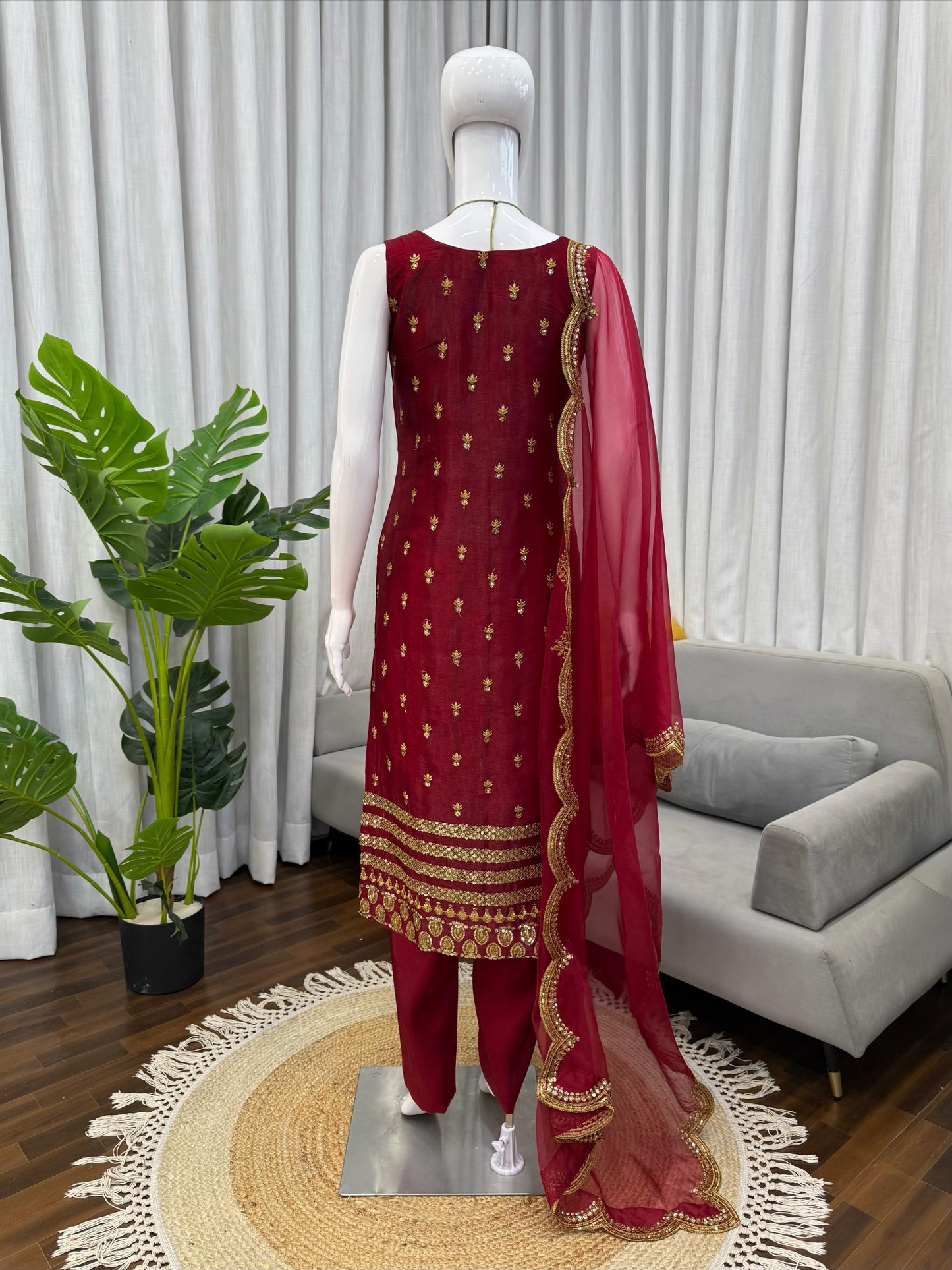 Maroon ethnic suit with gold embroidery, perfect for weddings and festivals